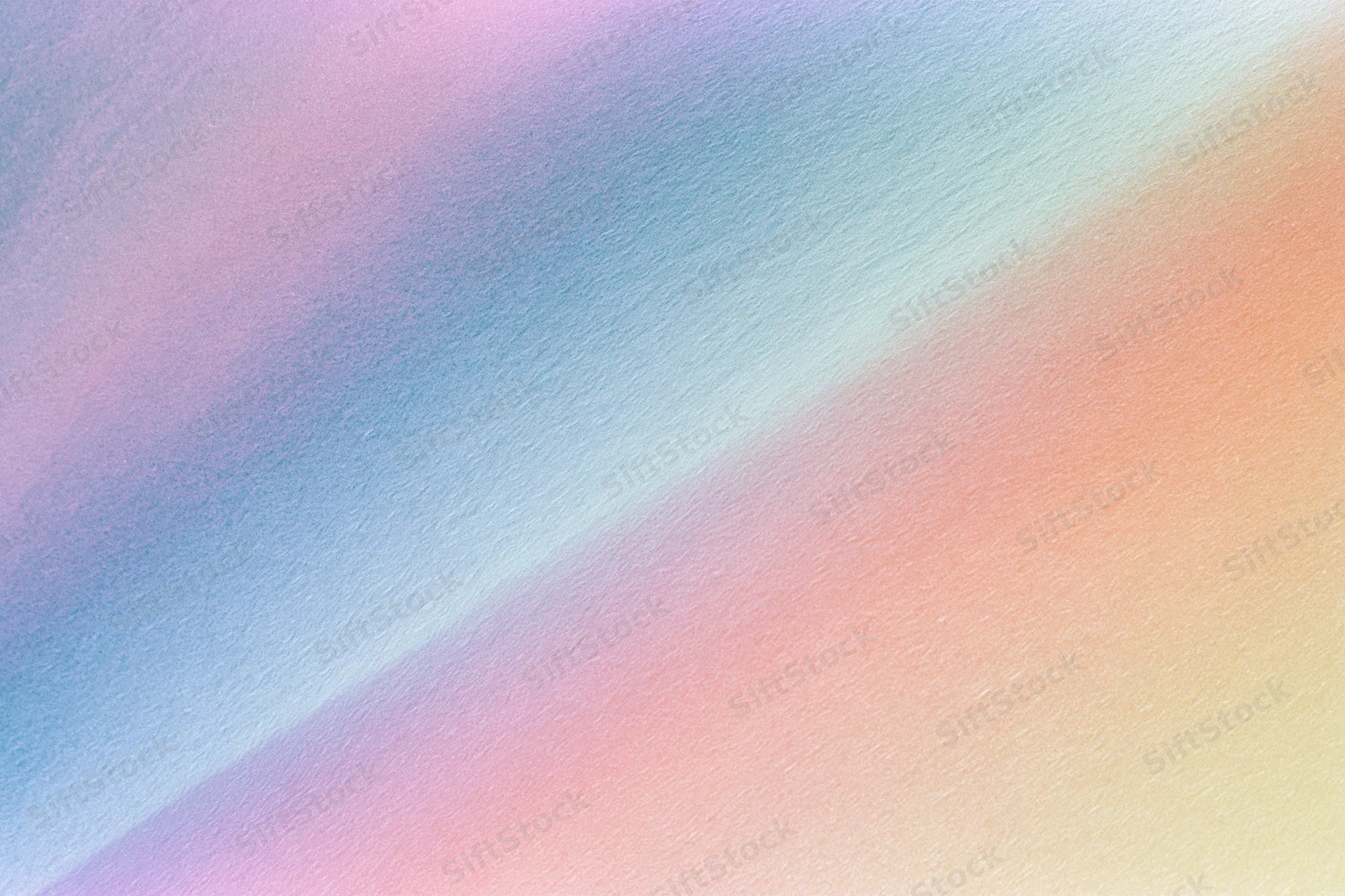 Smooth diagonal gradient of pastel colors blending across textured background