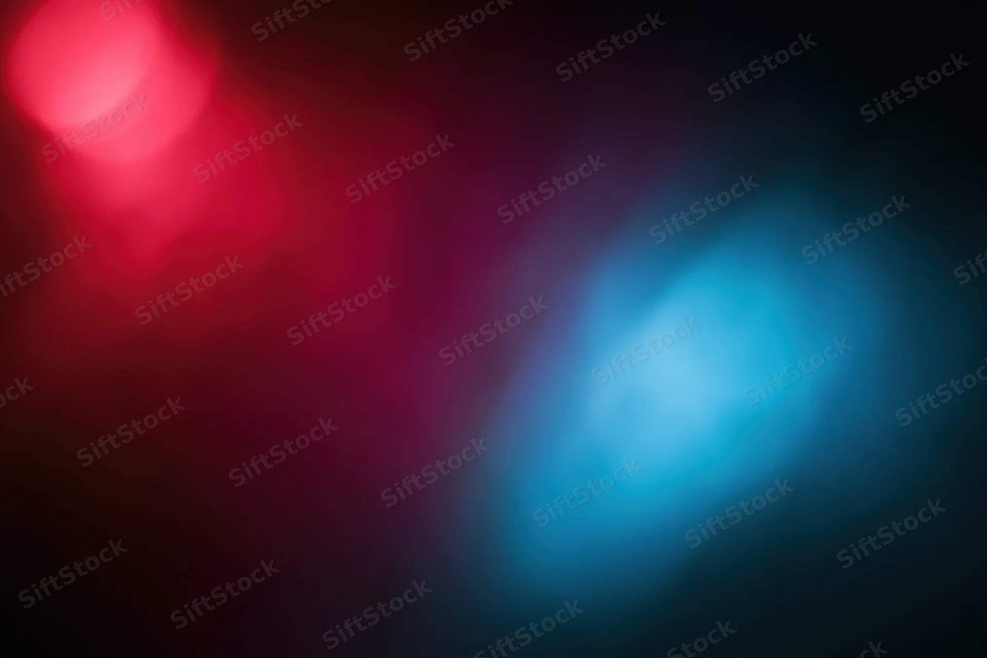 Abstract out-of-focus background with red and blue glowing lights