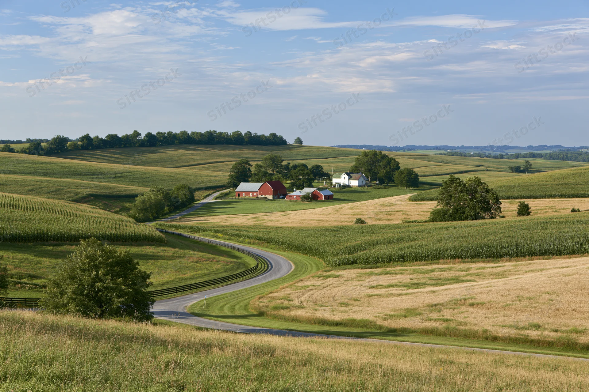 Farmstead with red barn and white farmhouse nestled among rolling hills and cornfields, accessed by a winding country road
