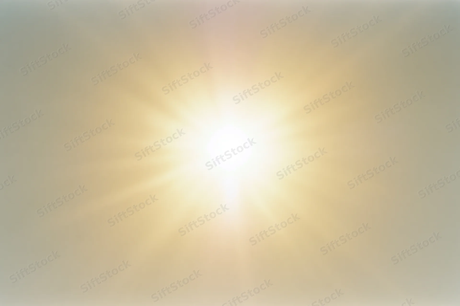 Bright midday sun glowing intensely against a pale white sky