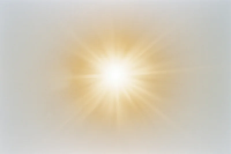 Bright midday sun radiating light against a pale white sky