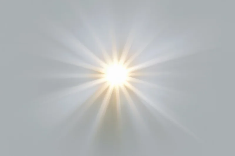 Bright sun burst with radiating light rays centered on a plain background