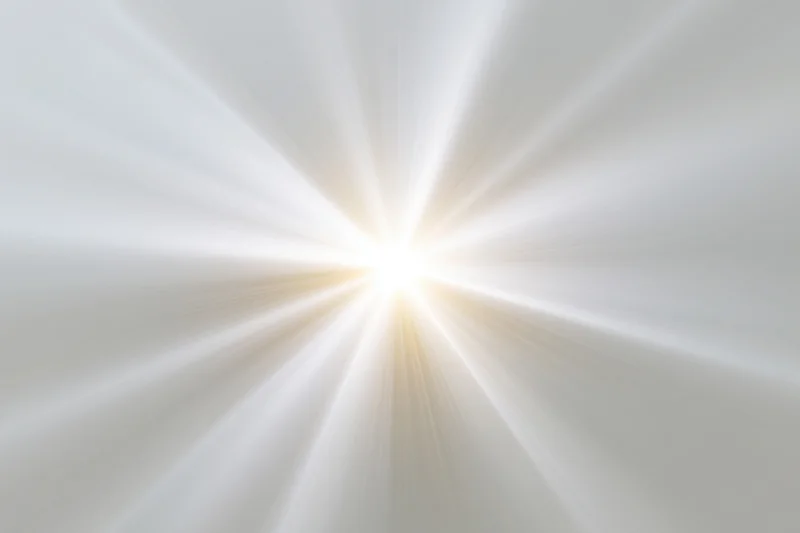 Bright white light burst with radial rays spreading outward from center