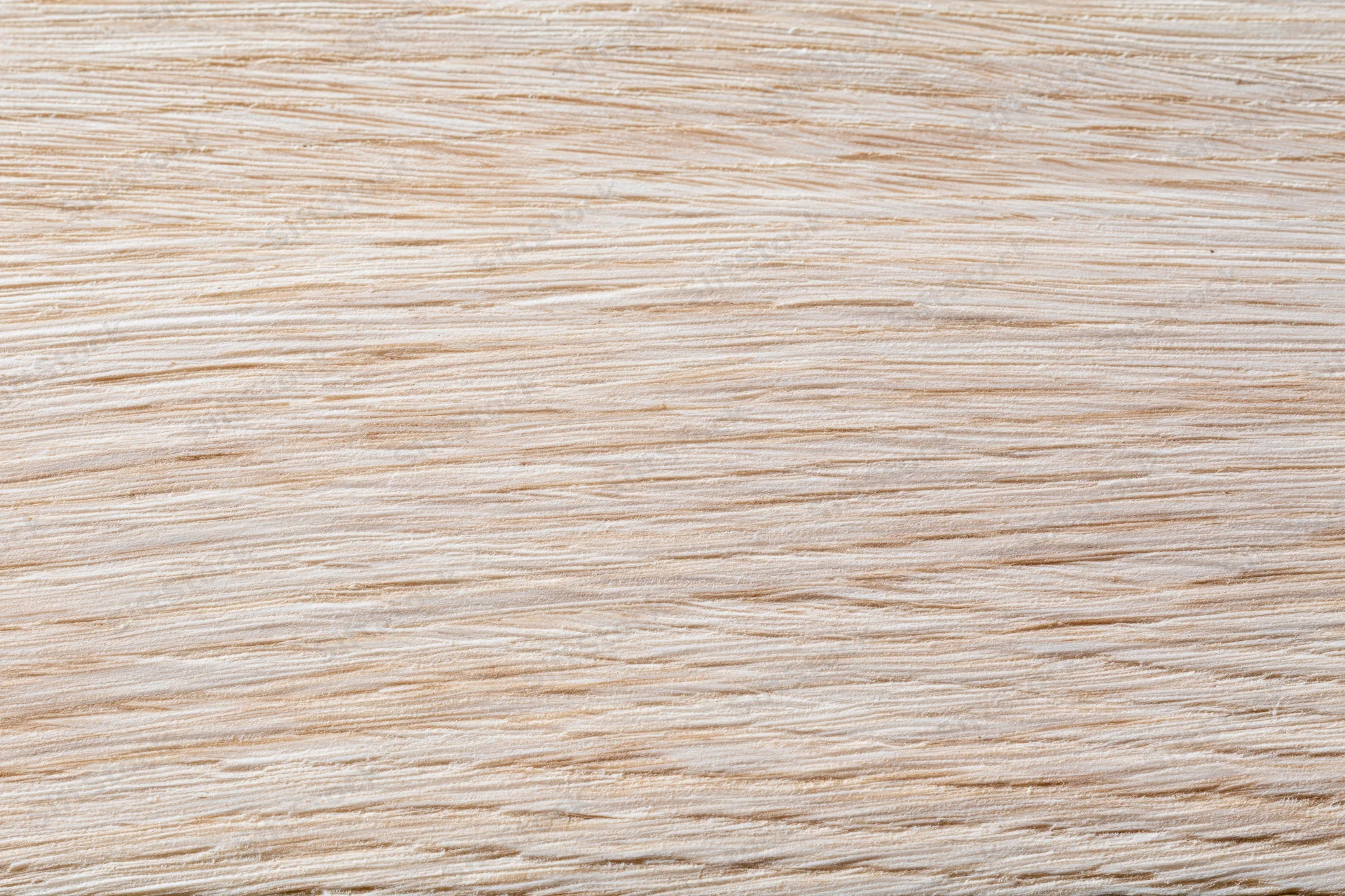 Close-up flat lay of a light bleached oak wood surface showing fine grain texture