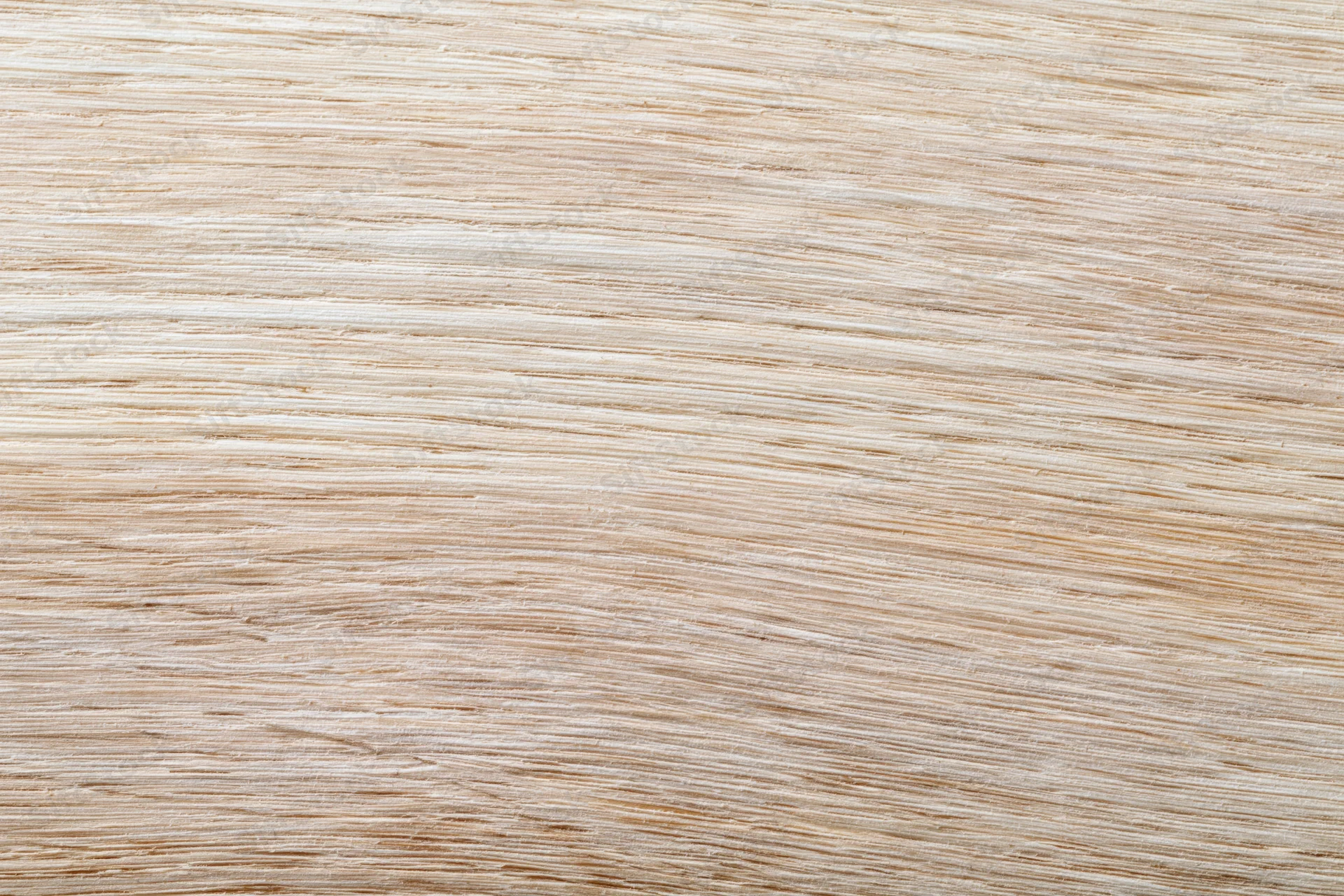 Close-up flat lay of a light bleached oak wood surface showing fine grain texture