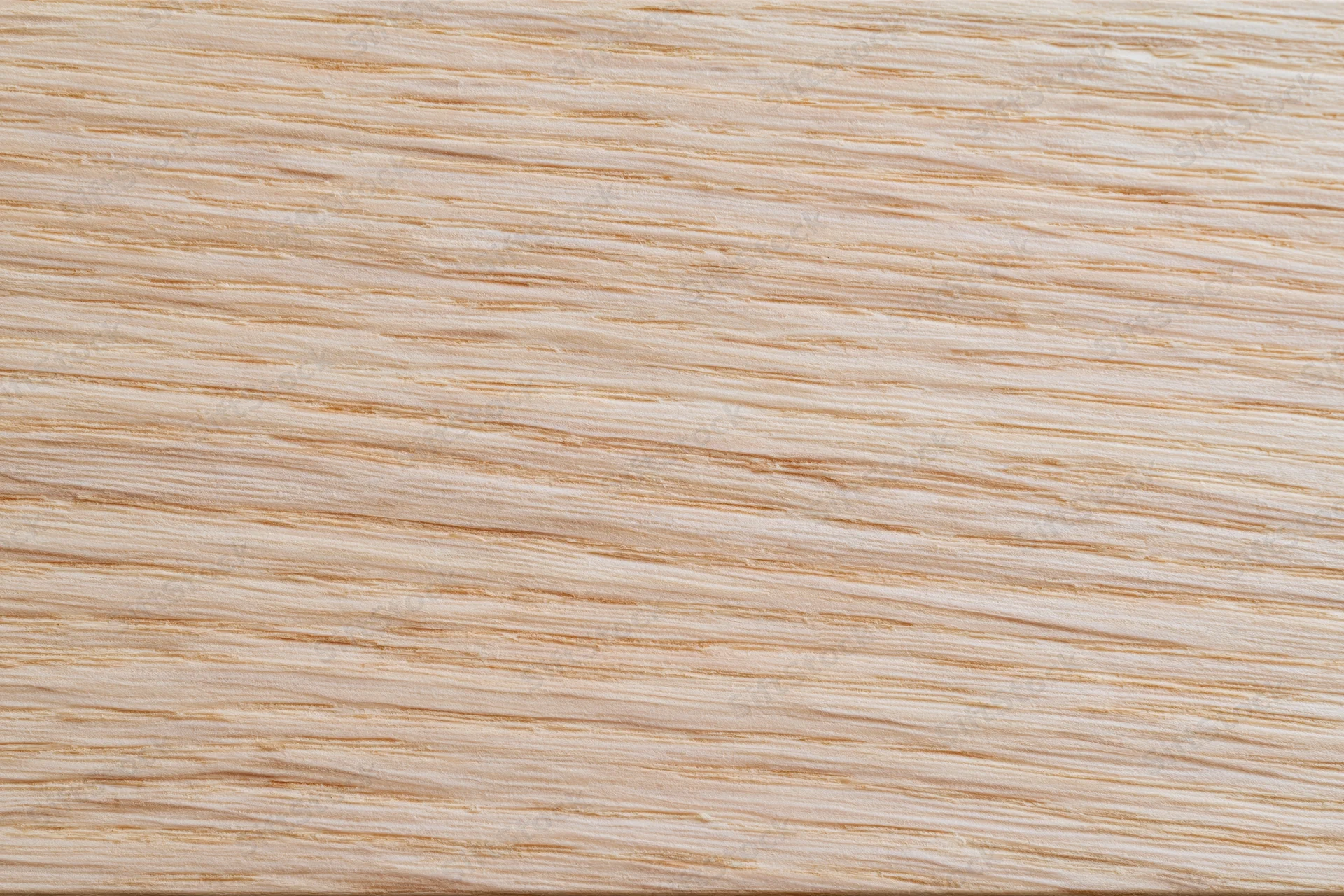 Close-up flat lay of a light bleached oak wood surface showing fine grain texture