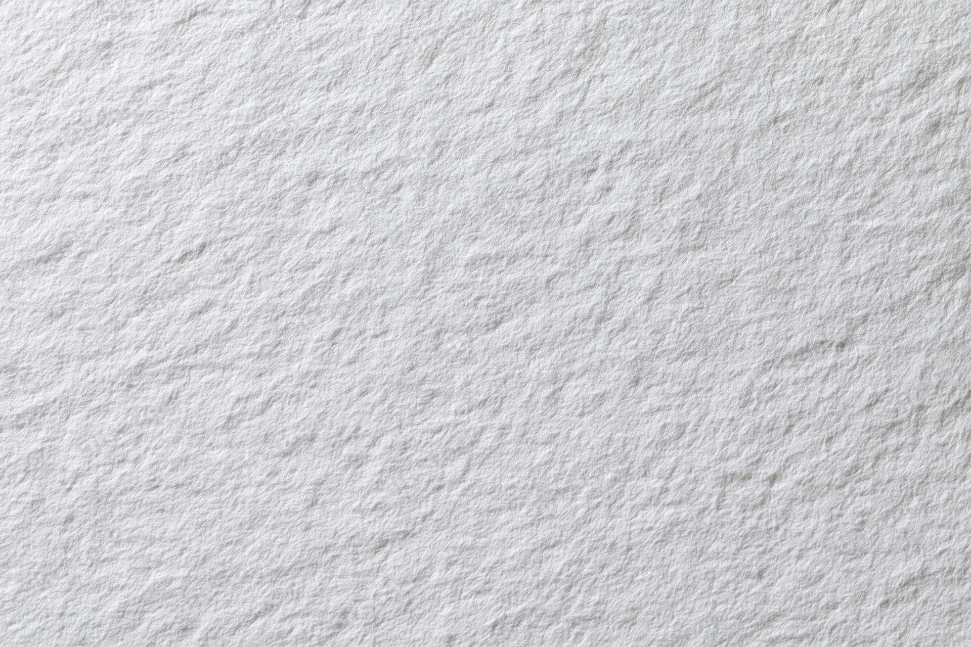 Close-up flat lay of plain white paper texture filling the frame