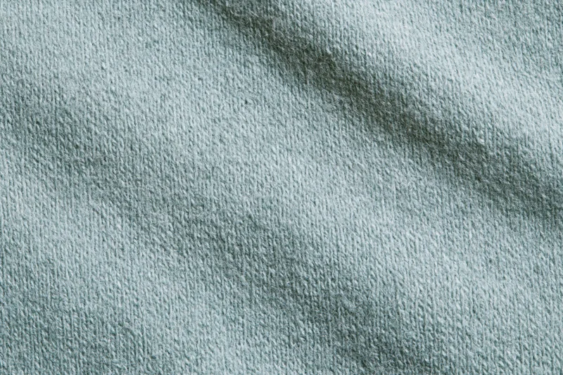 Close-up flat lay of plain woven fabric filling the entire frame