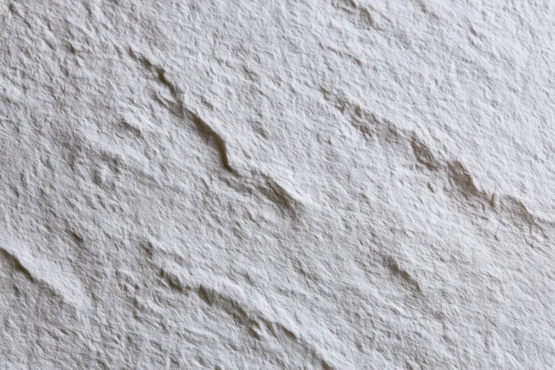 Close-up of white textured paper surface filling the frame