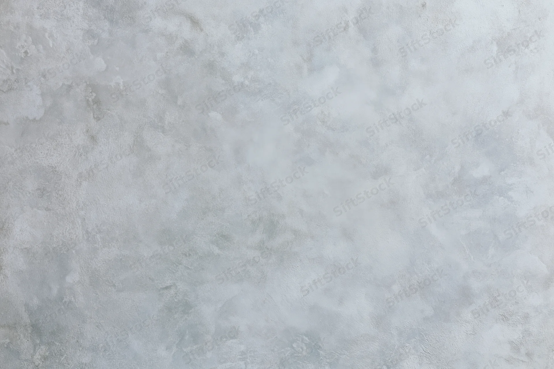 Close-up of a bare concrete wall surface with rough texture filling the frame
