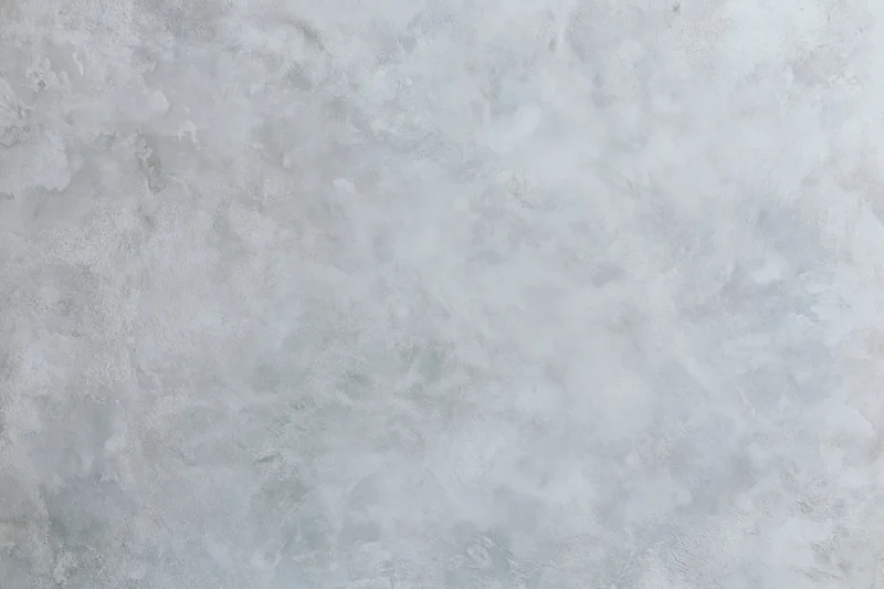 Close-up of a bare concrete wall surface with rough texture filling the frame