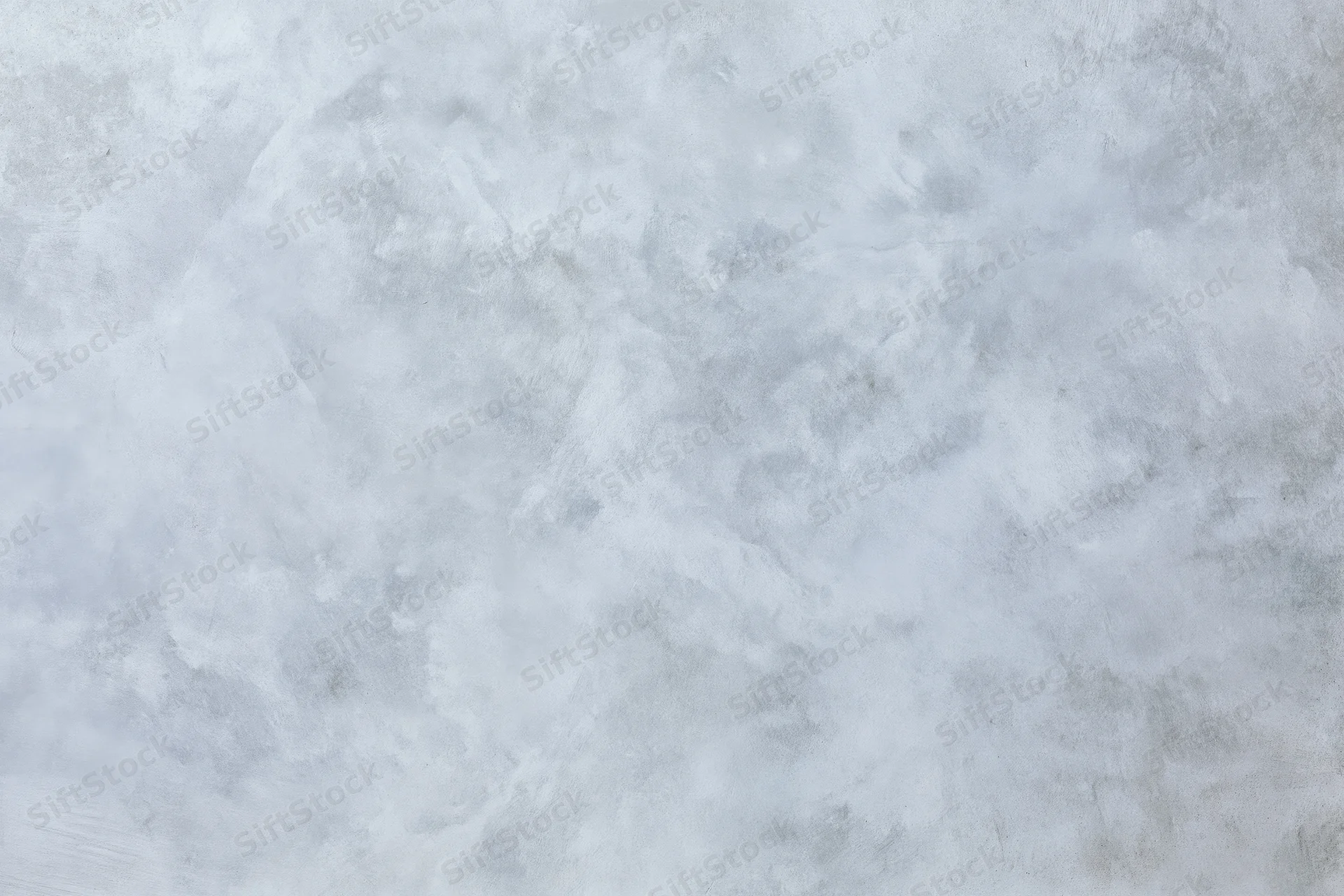 Close-up of a bare concrete wall surface with rough texture filling the frame