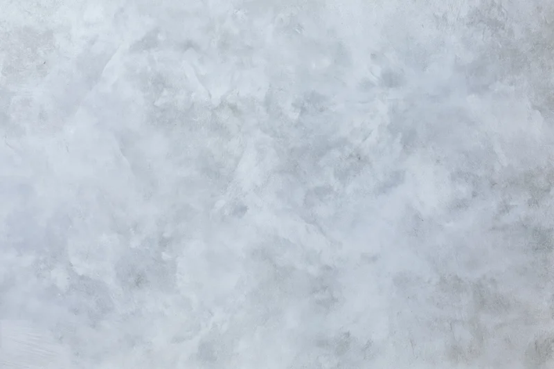 Close-up of a bare concrete wall surface with rough texture filling the frame