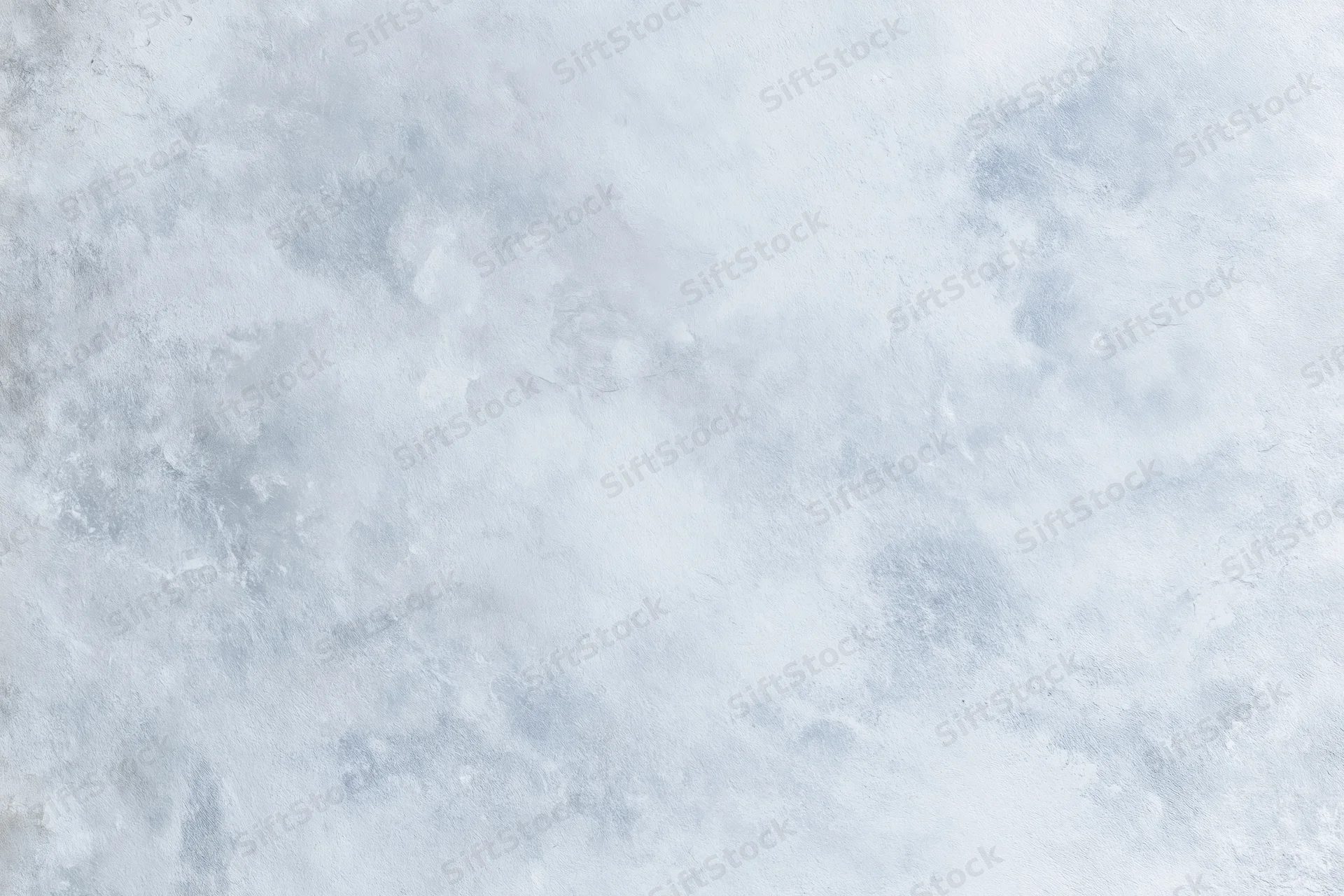 Close-up of a bare concrete wall surface with rough texture and gray tones filling the frame