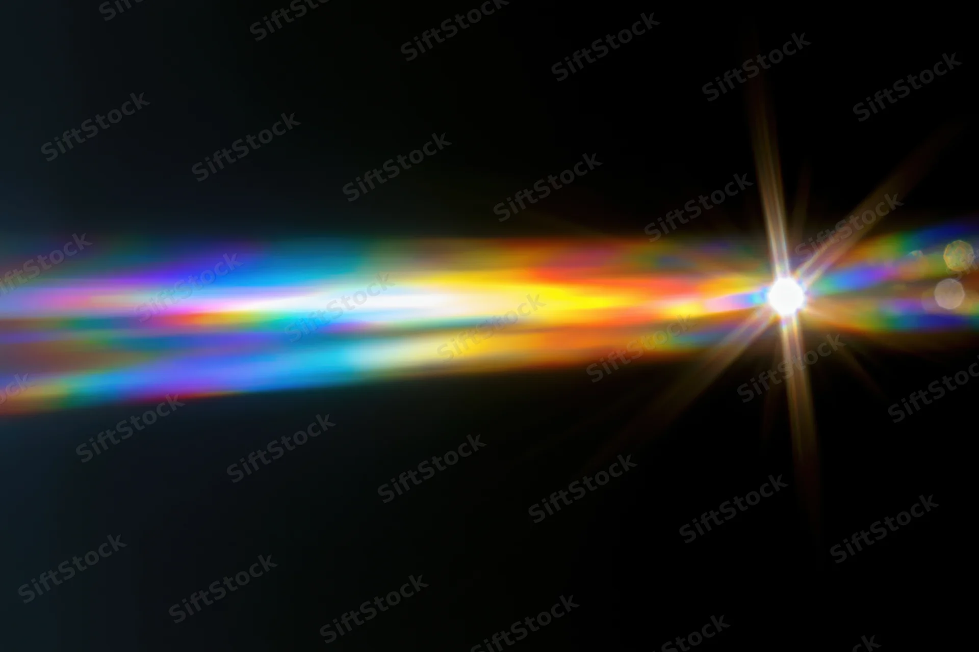 Rainbow light diffraction pattern floating against dark background with lens flare and spectrum glow
