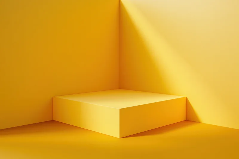 Yellow minimalist product display pedestal in a studio corner
