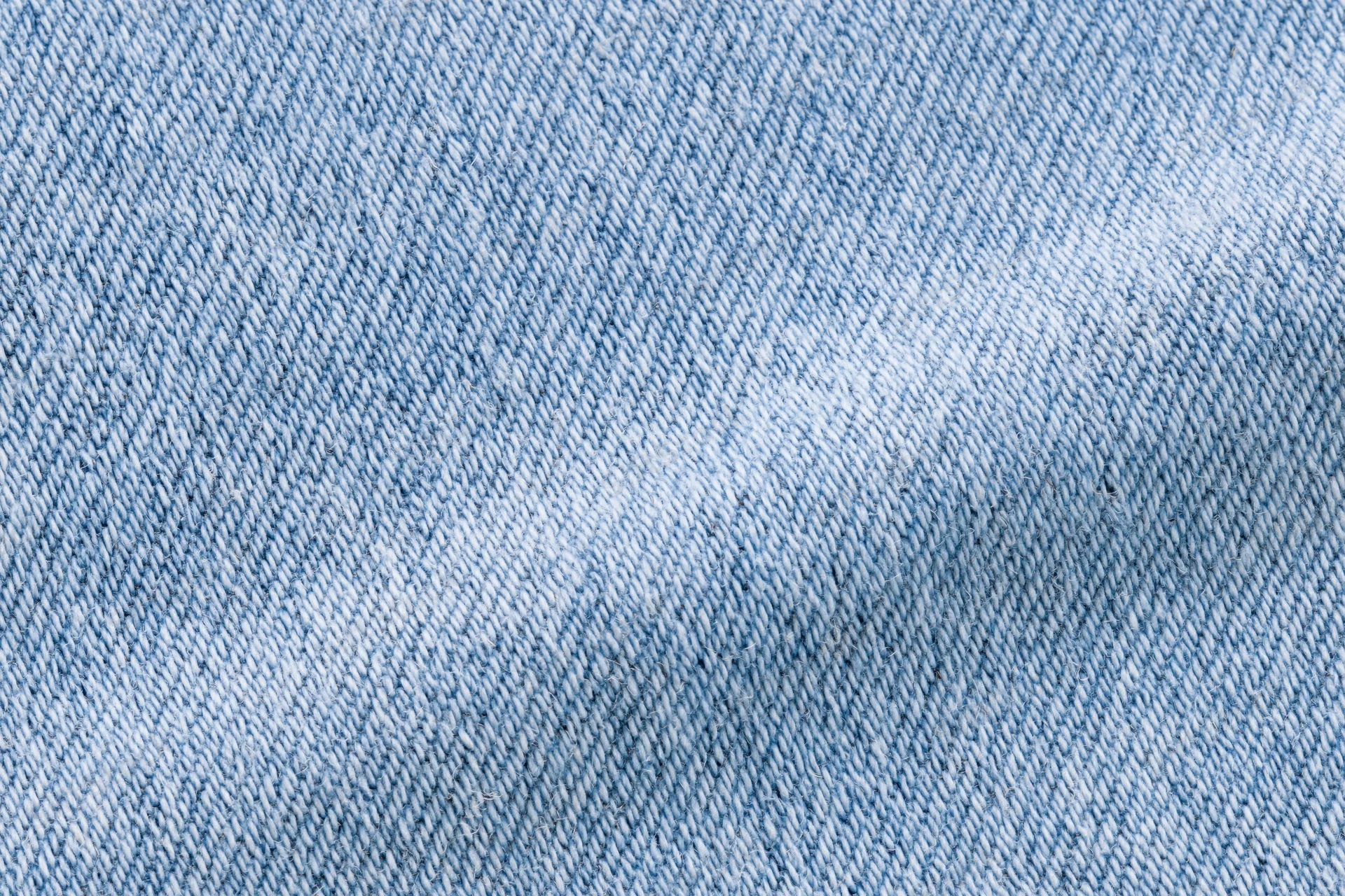 Light washed denim fabric in extreme close-up macro view