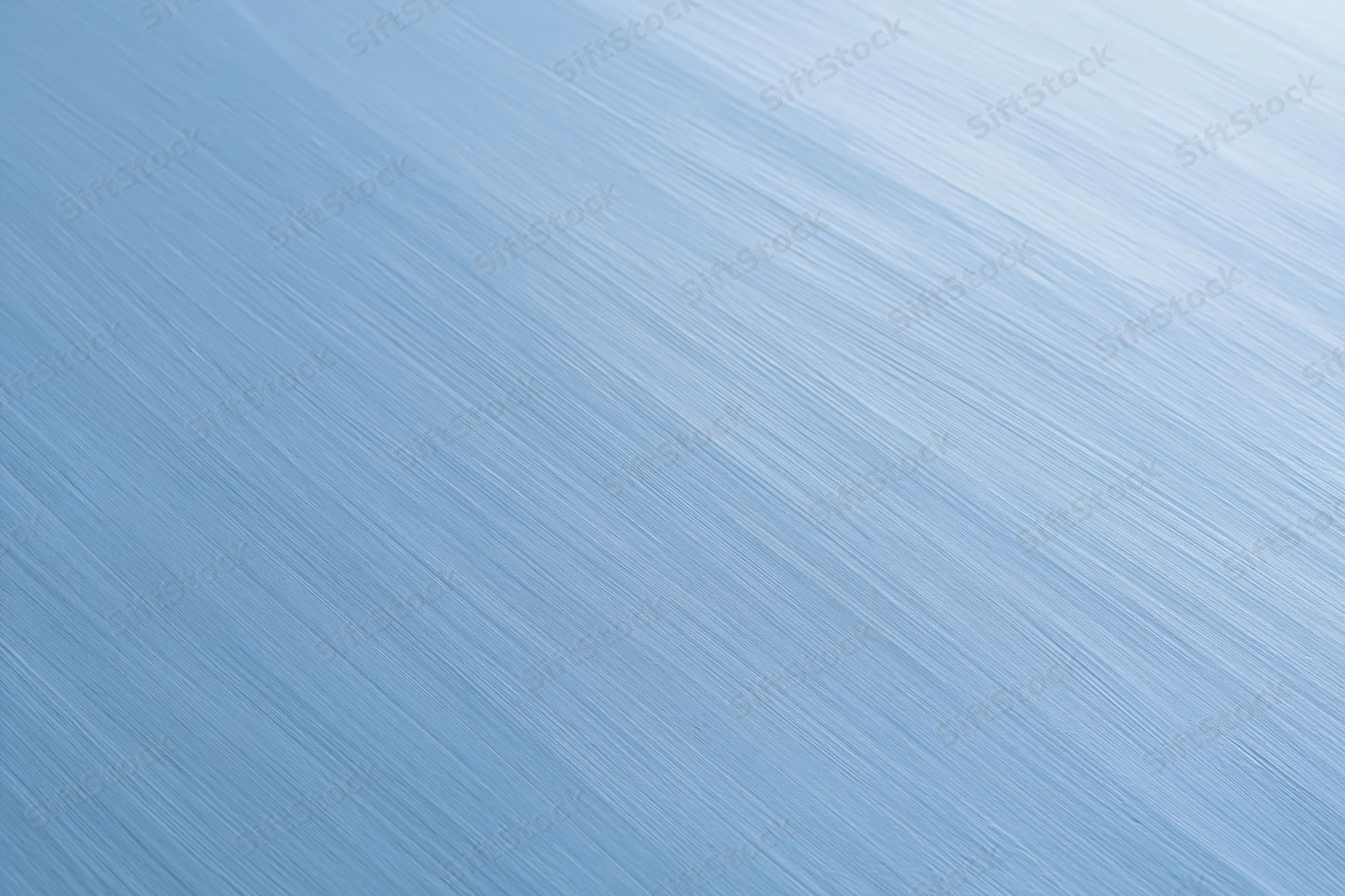 Brushed light blue metal surface filling the frame as a seamless background