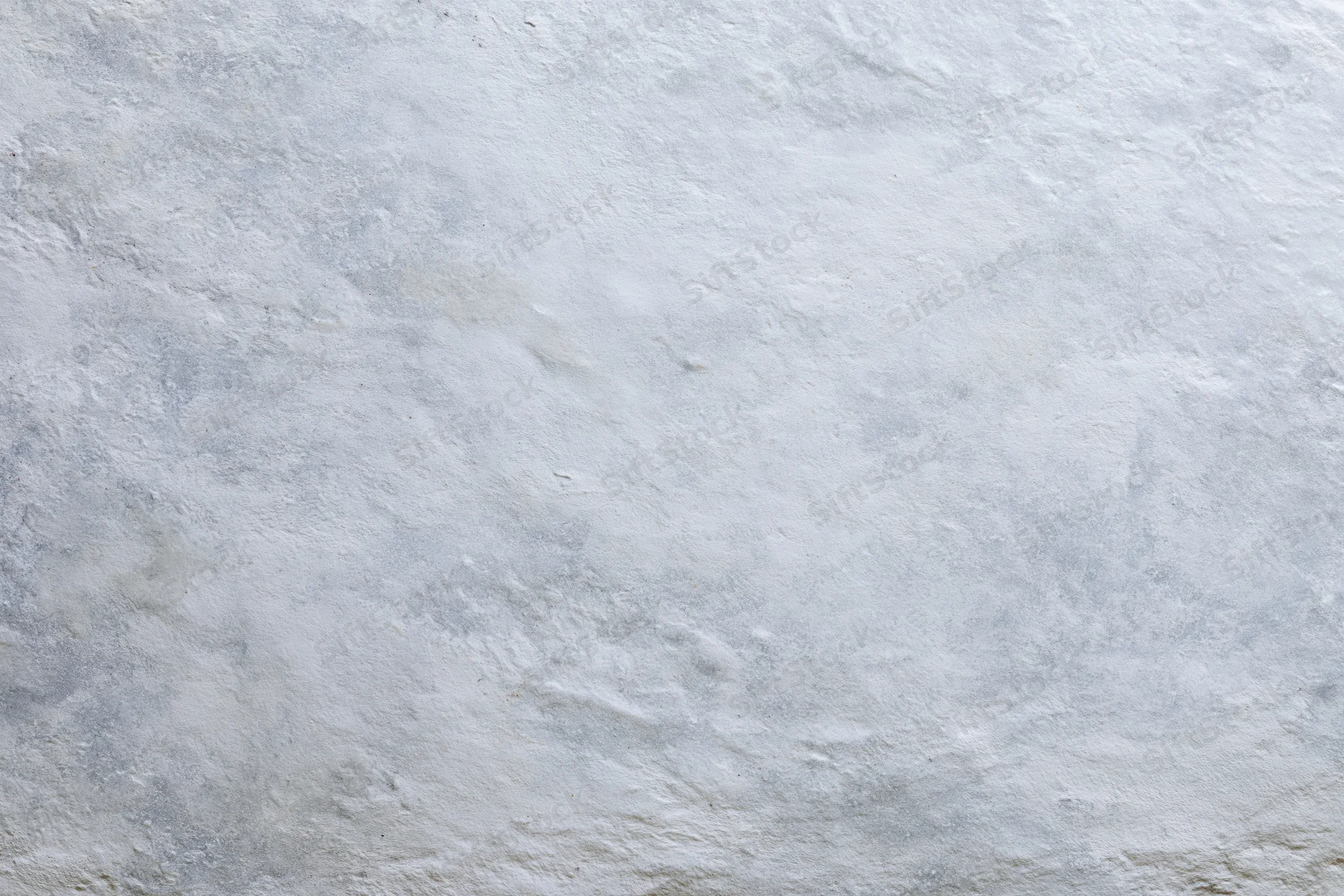 Flat concrete wall surface filling the frame in close-up view