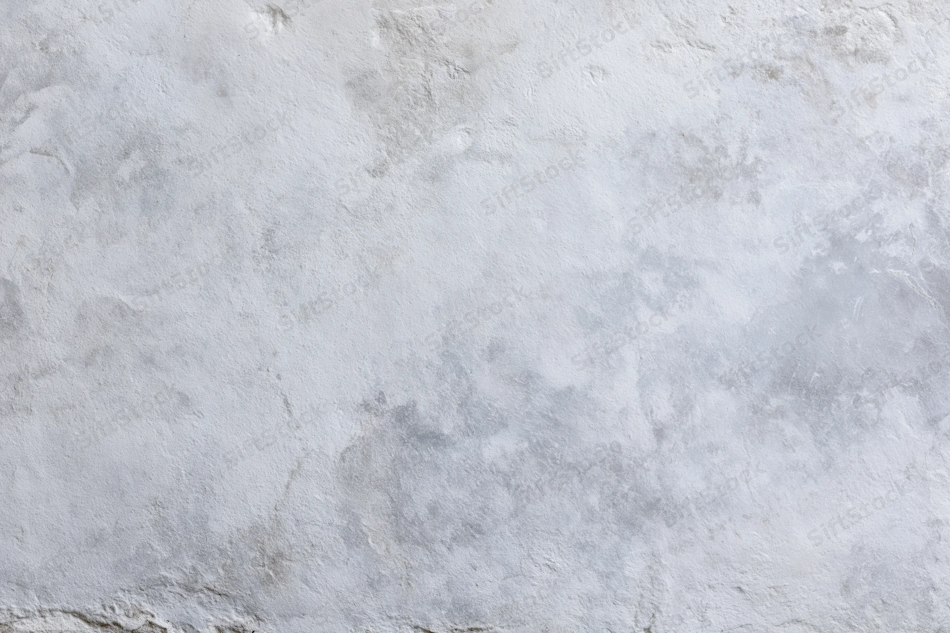 Flat concrete wall surface filling the frame in close-up view