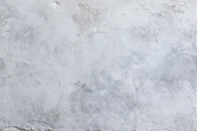 Flat concrete wall surface filling the frame in close-up view