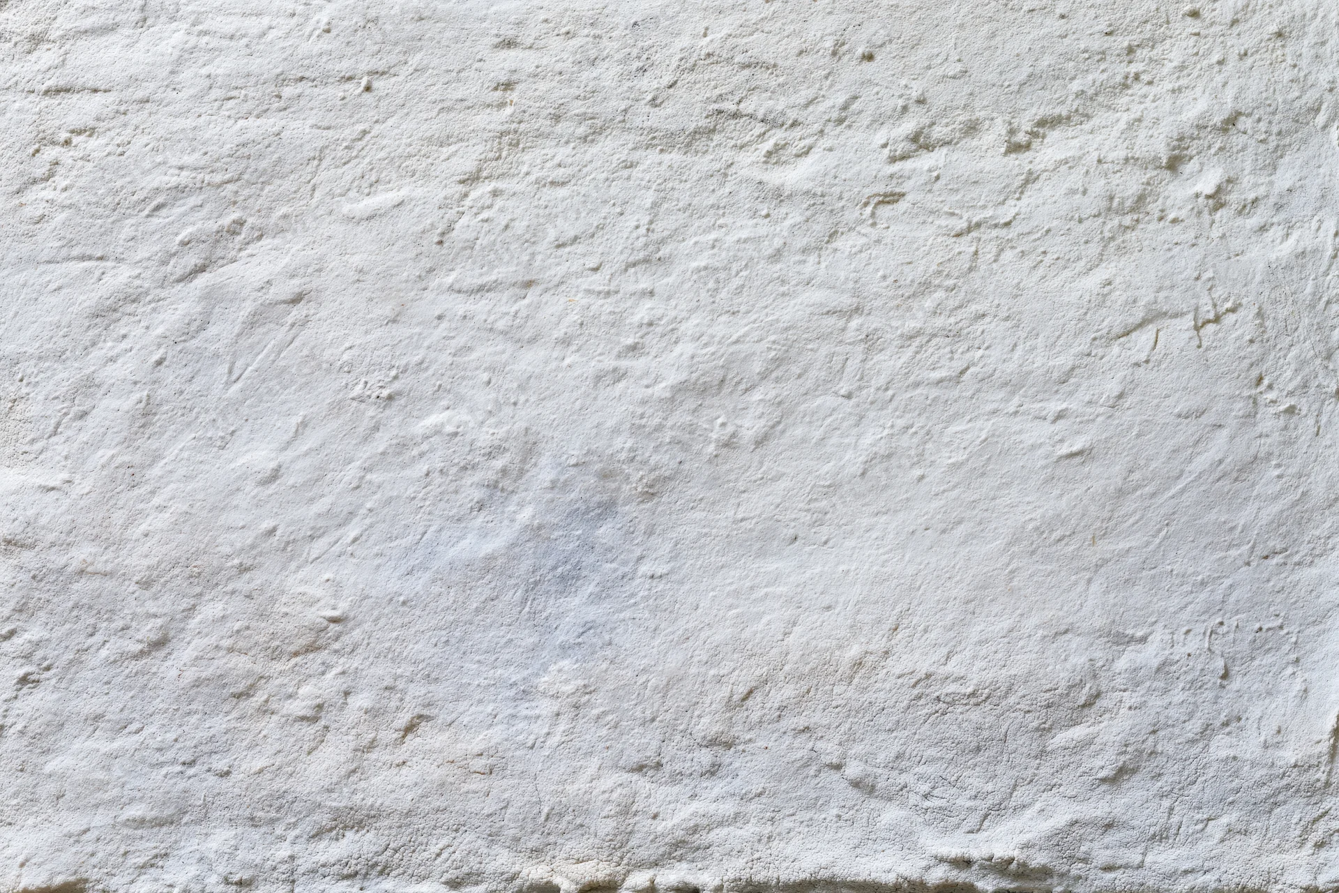 Close-up of a rough concrete wall surface filling the frame