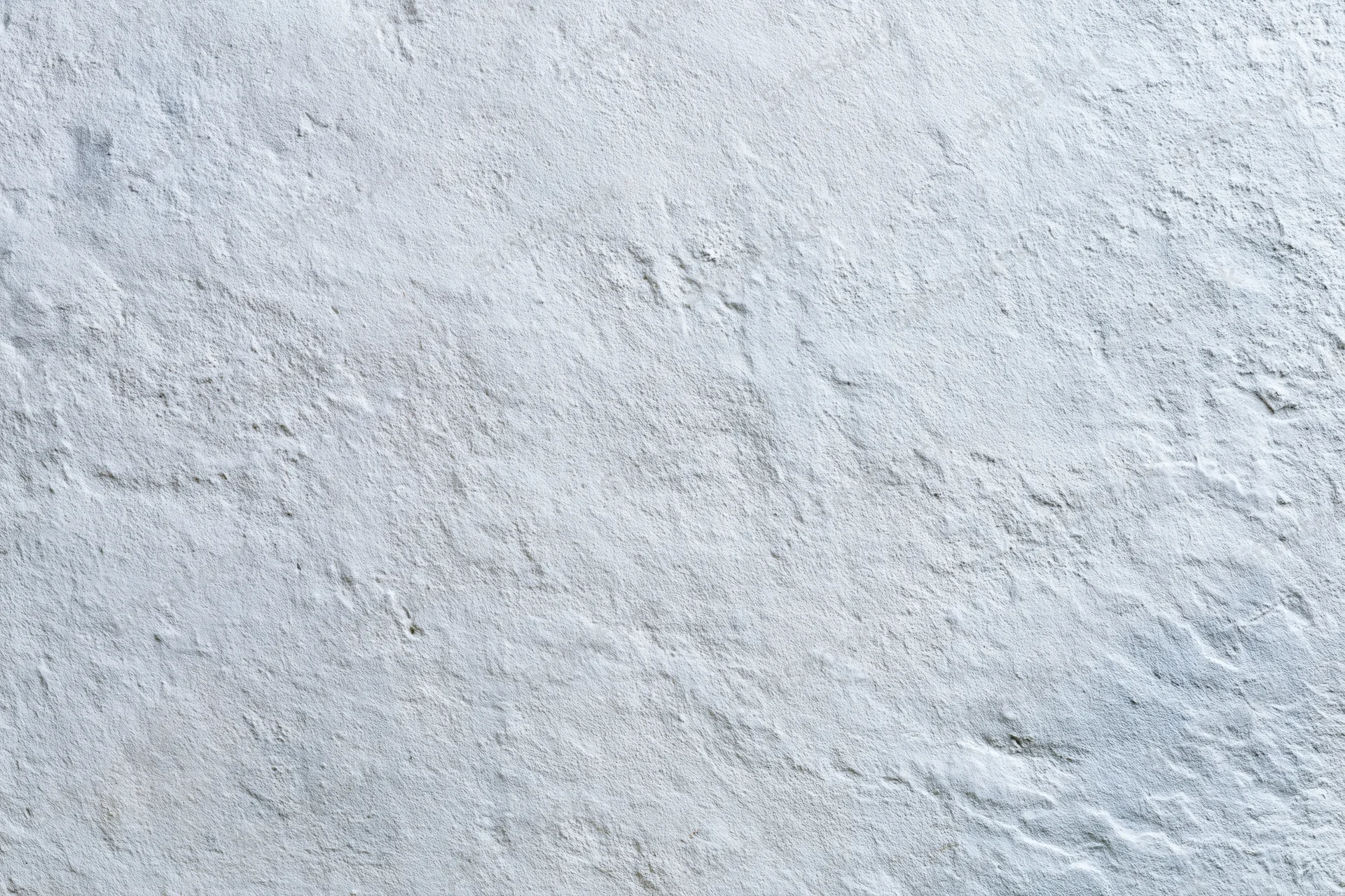 Flat concrete wall surface filling the frame in close-up view