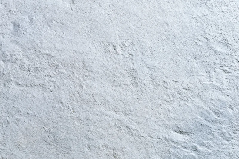 Flat concrete wall surface filling the frame in close-up view