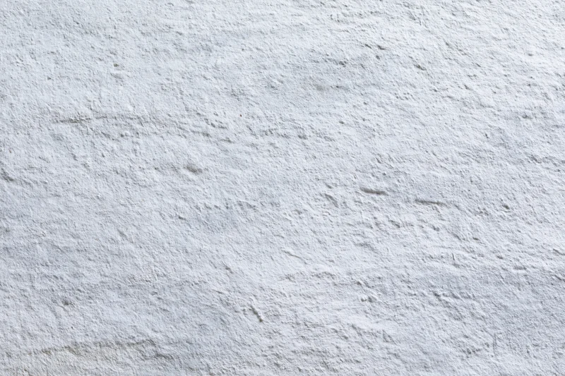 Flat concrete wall surface filling the frame with rough texture and gray tone