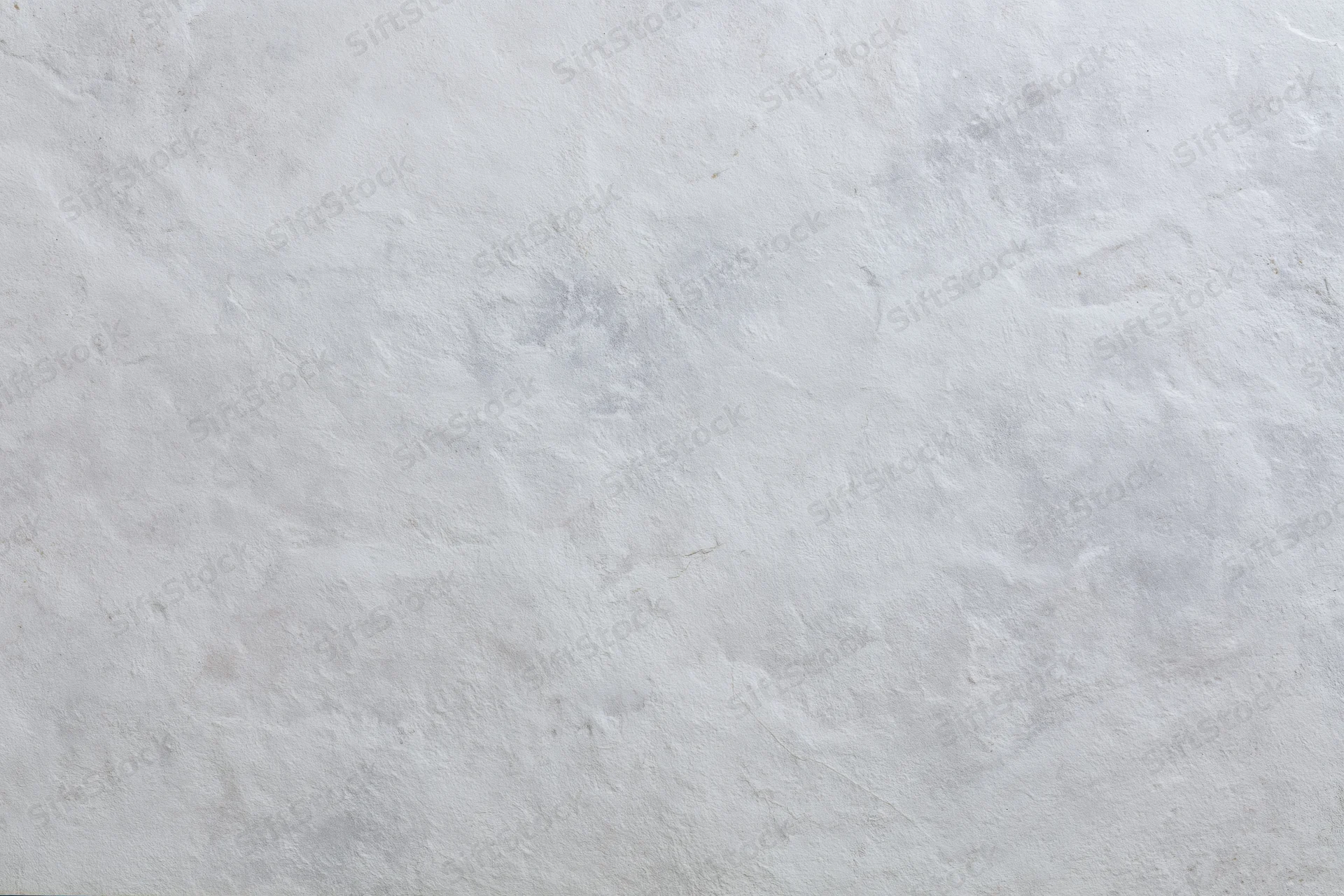 Flat concrete wall surface filling the frame in close-up view