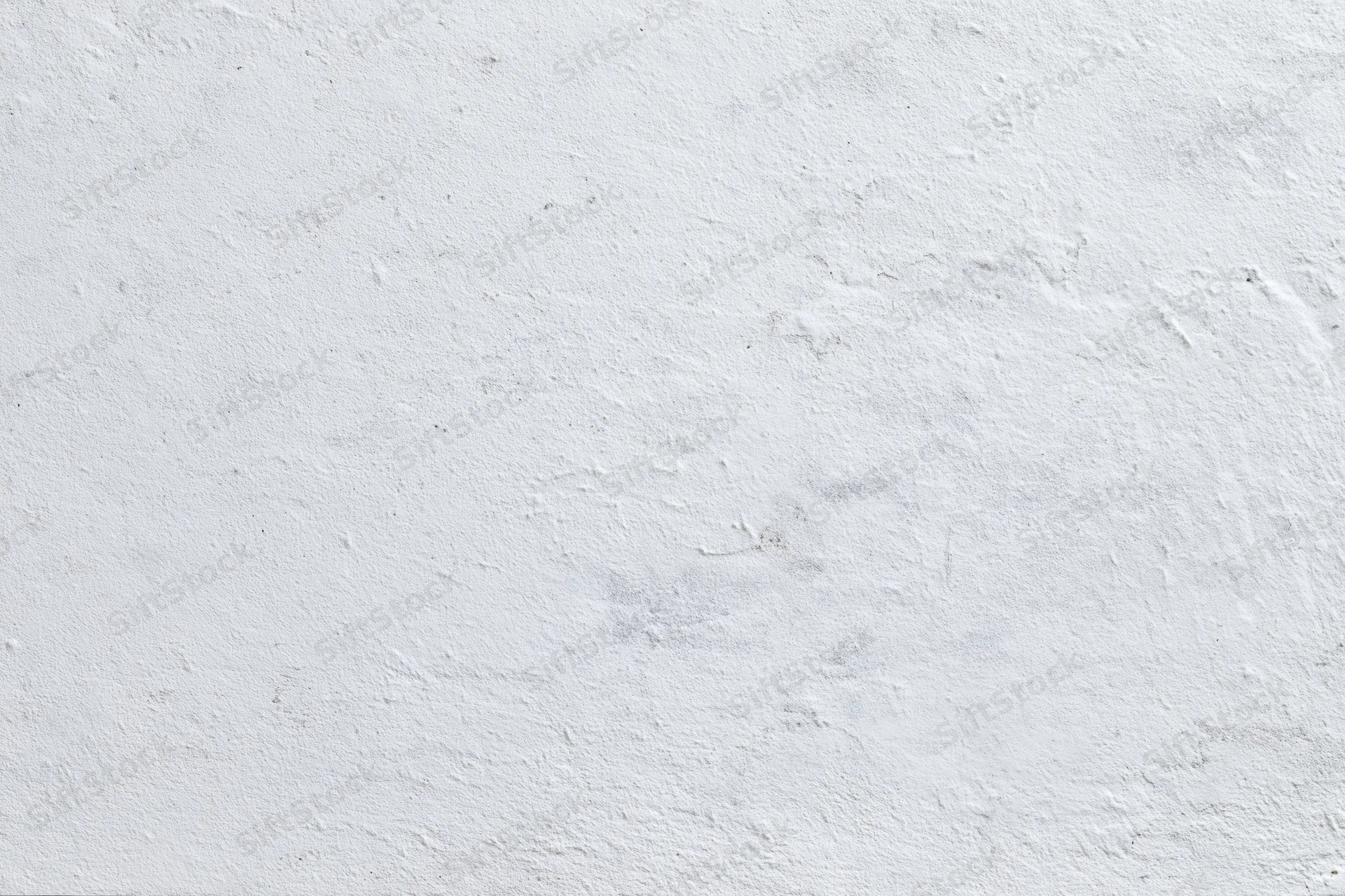 Close-up of a rough concrete wall surface filling the frame
