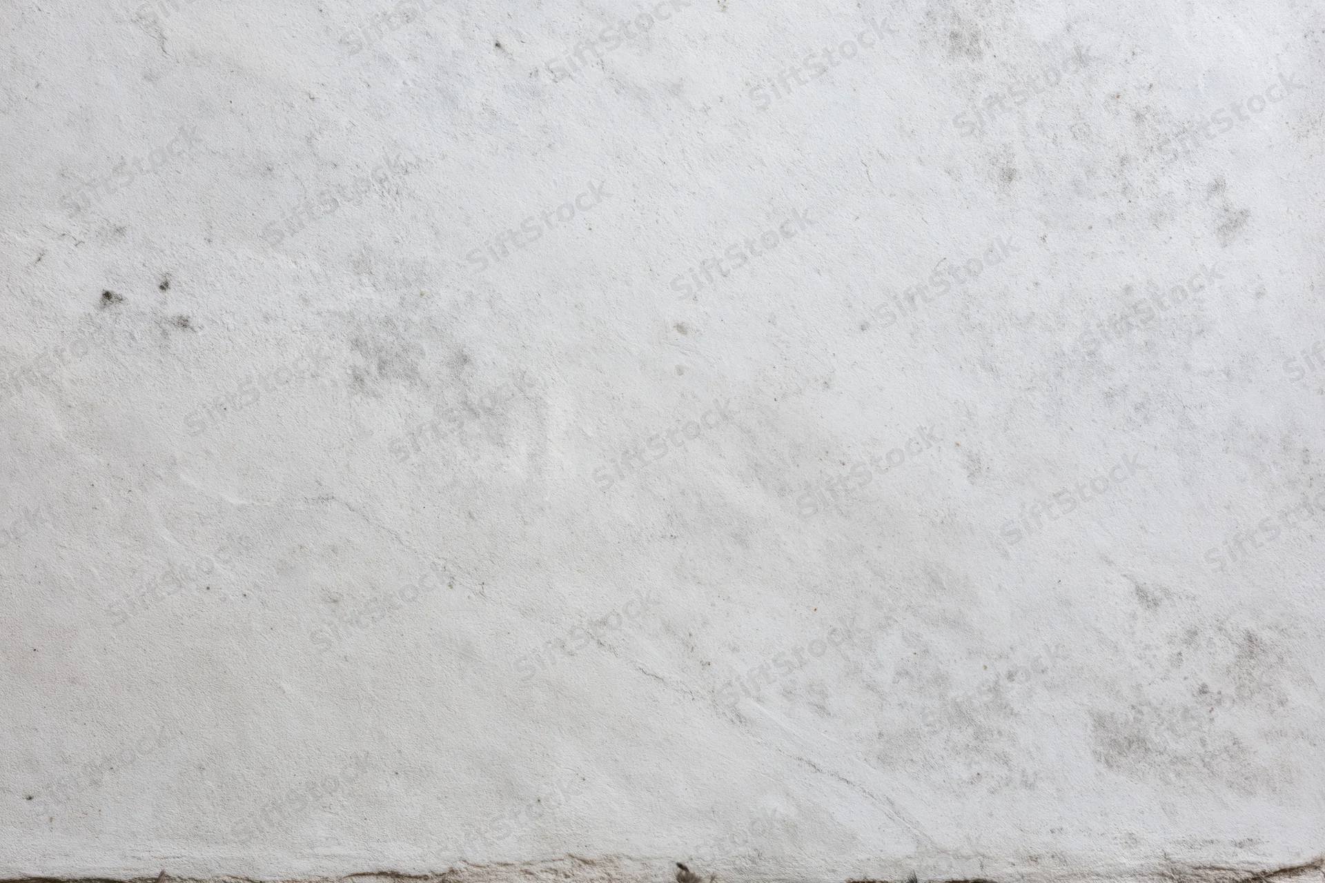 Close-up of a weathered concrete wall surface filling the frame