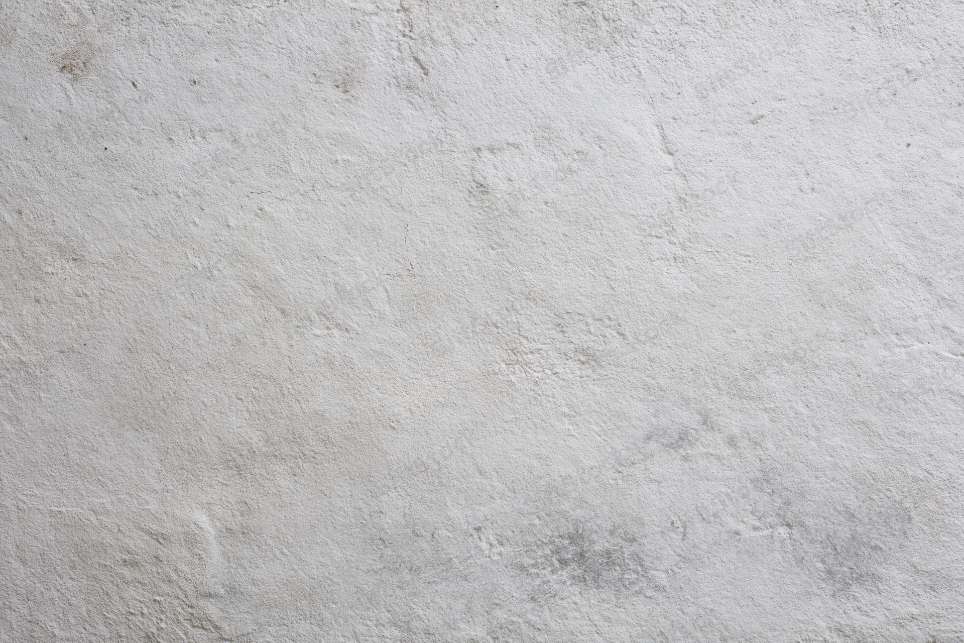 Close-up of a textured concrete wall surface filling the frame