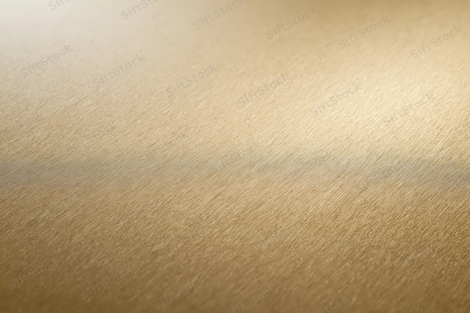Flat matte gold metallic surface filling the frame as a seamless background