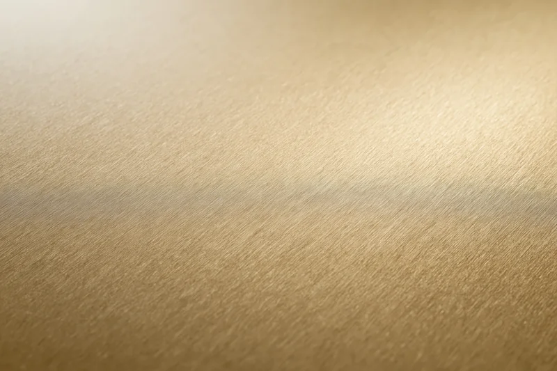 Flat matte gold metallic surface filling the frame as a seamless background