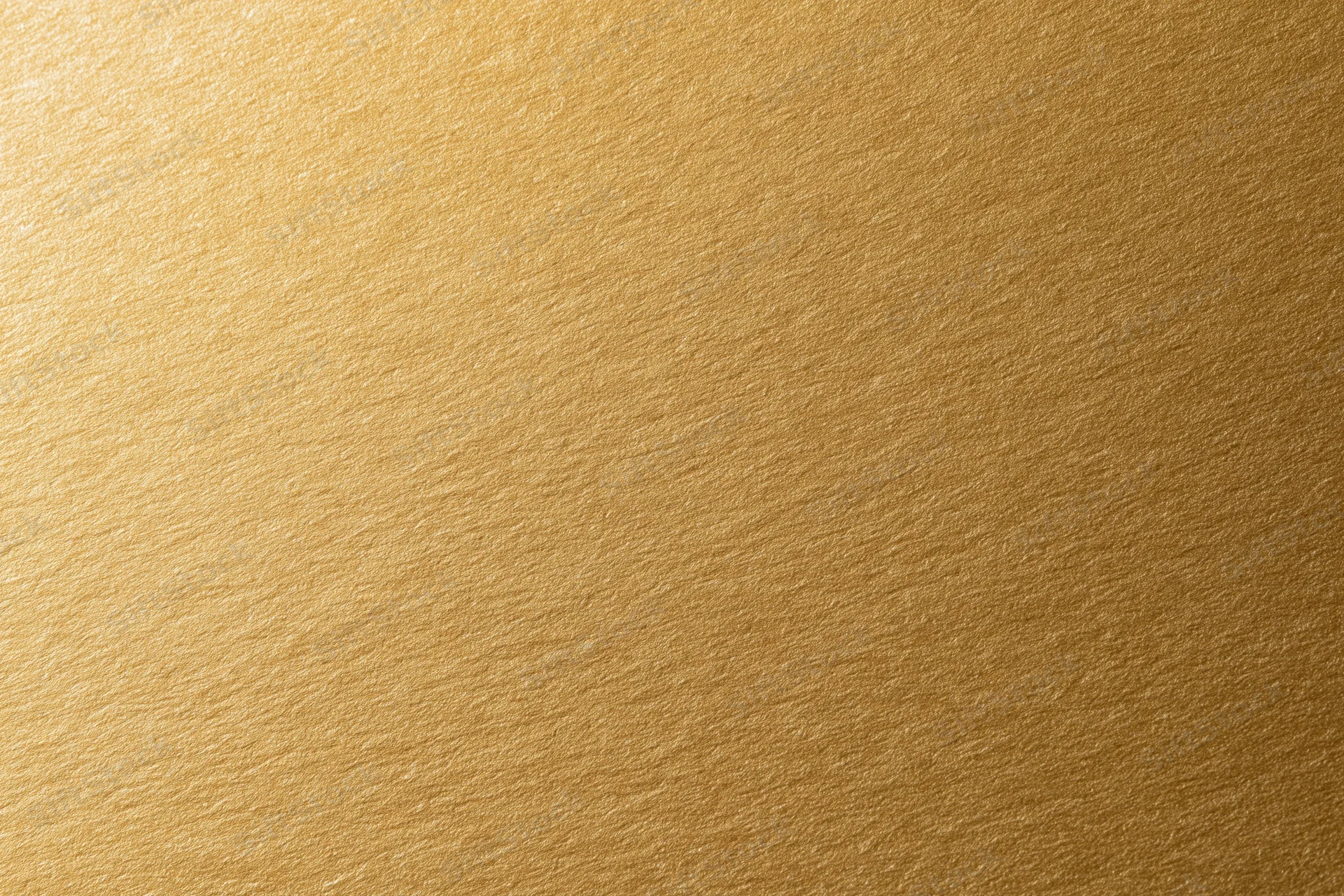 Flat matte gold metallic surface filling the frame as a seamless background