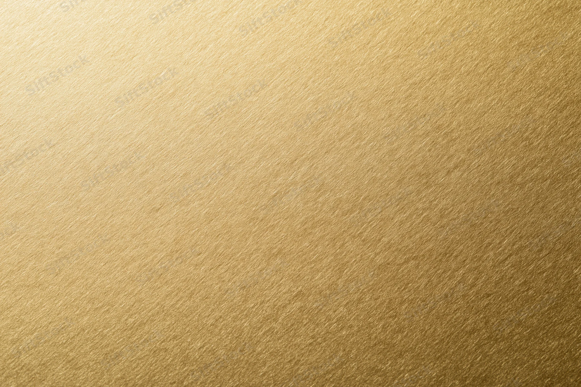 Flat matte gold metallic surface filling the frame as a seamless background