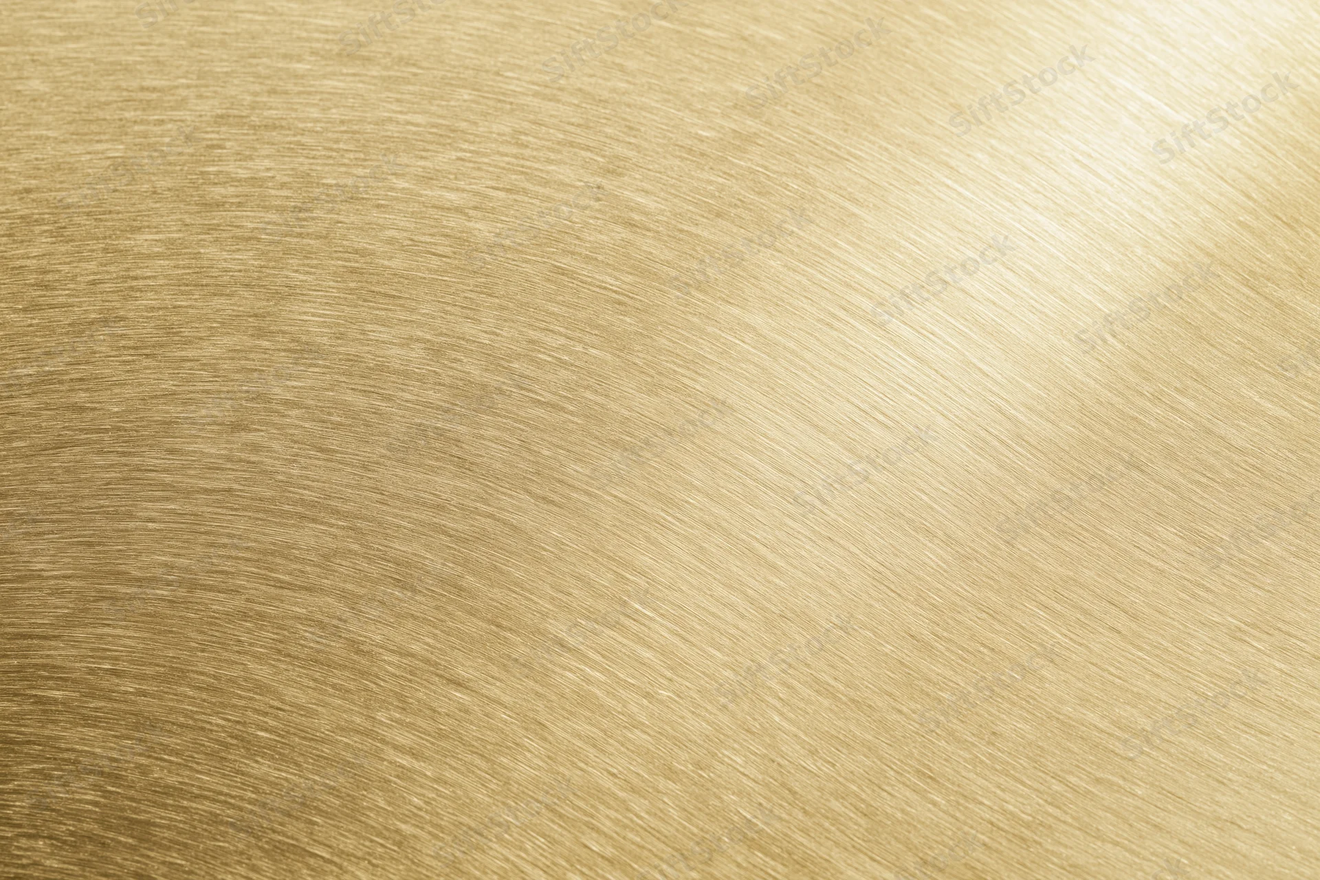 Flat matte gold metallic surface filling the frame as a seamless background