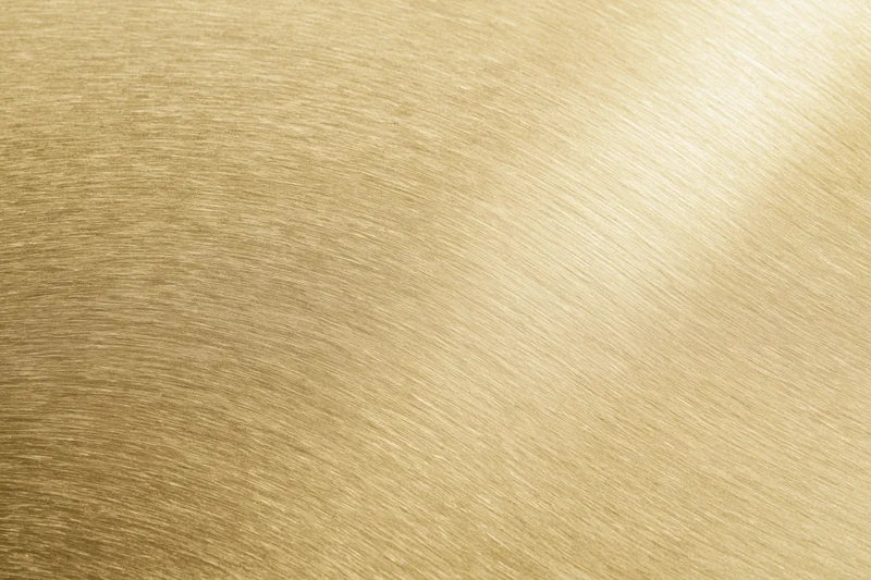 Flat matte gold metallic surface filling the frame as a seamless background