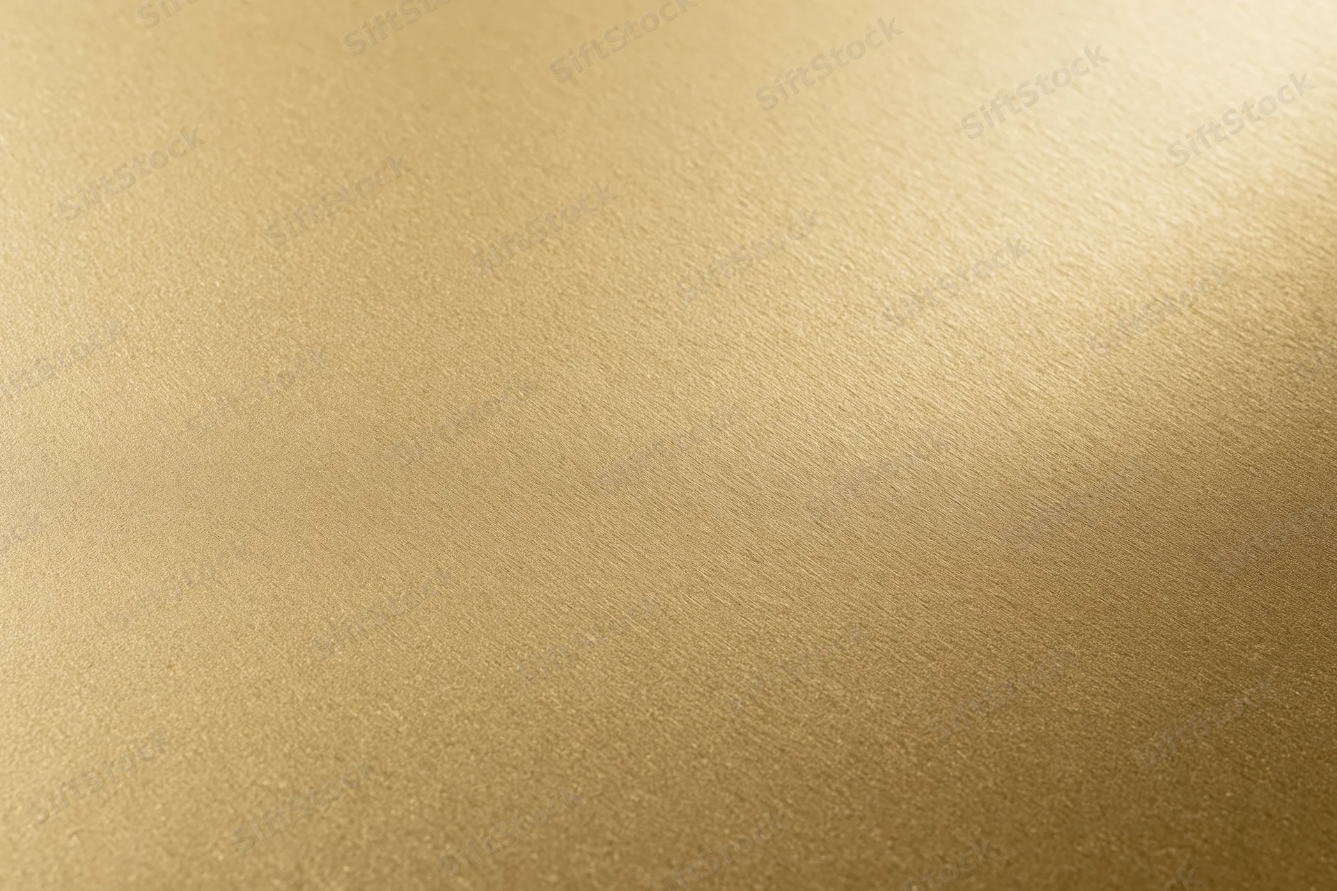 Flat matte gold metallic surface filling the frame as a seamless background