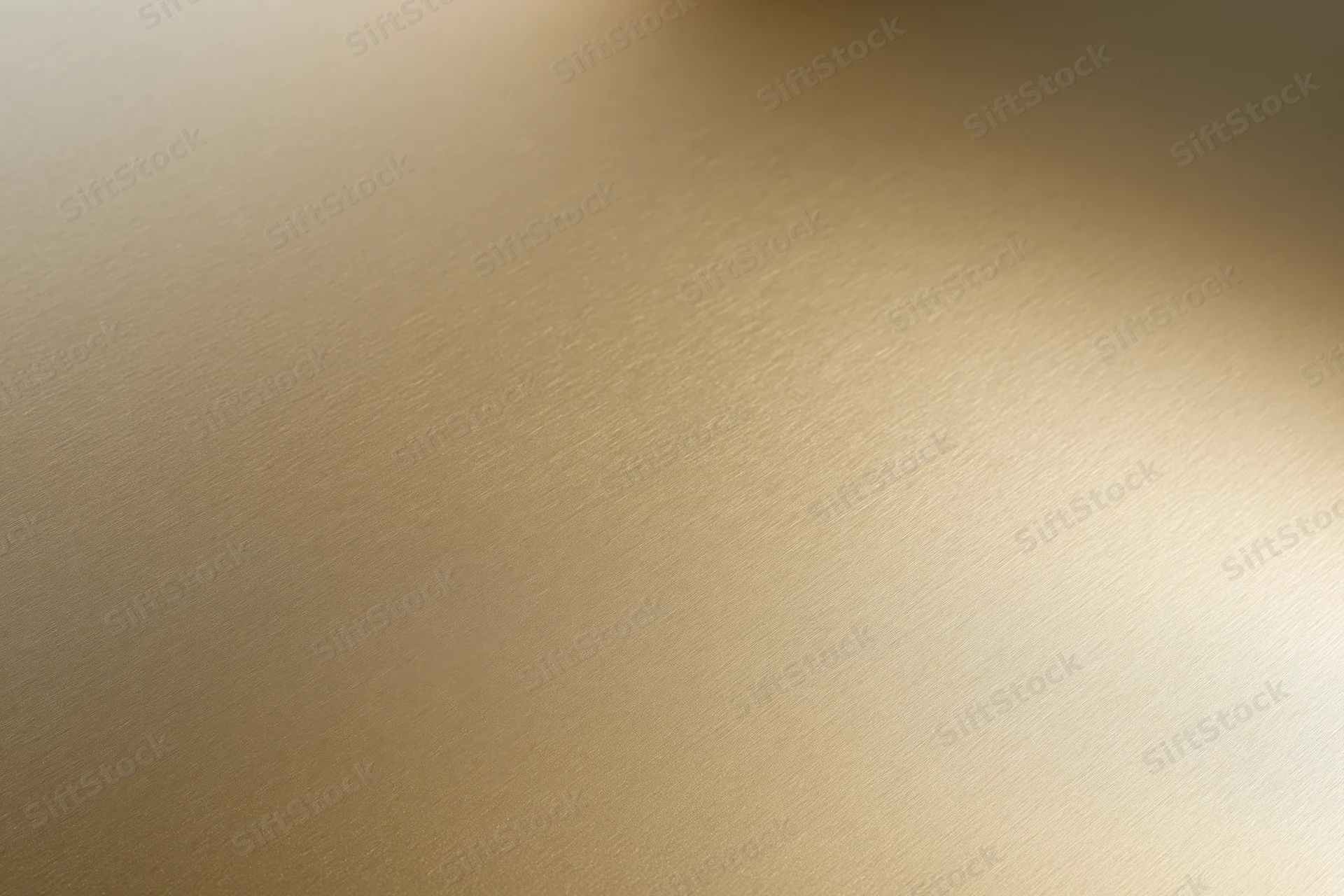 Flat matte gold metallic surface filling the frame as a seamless background