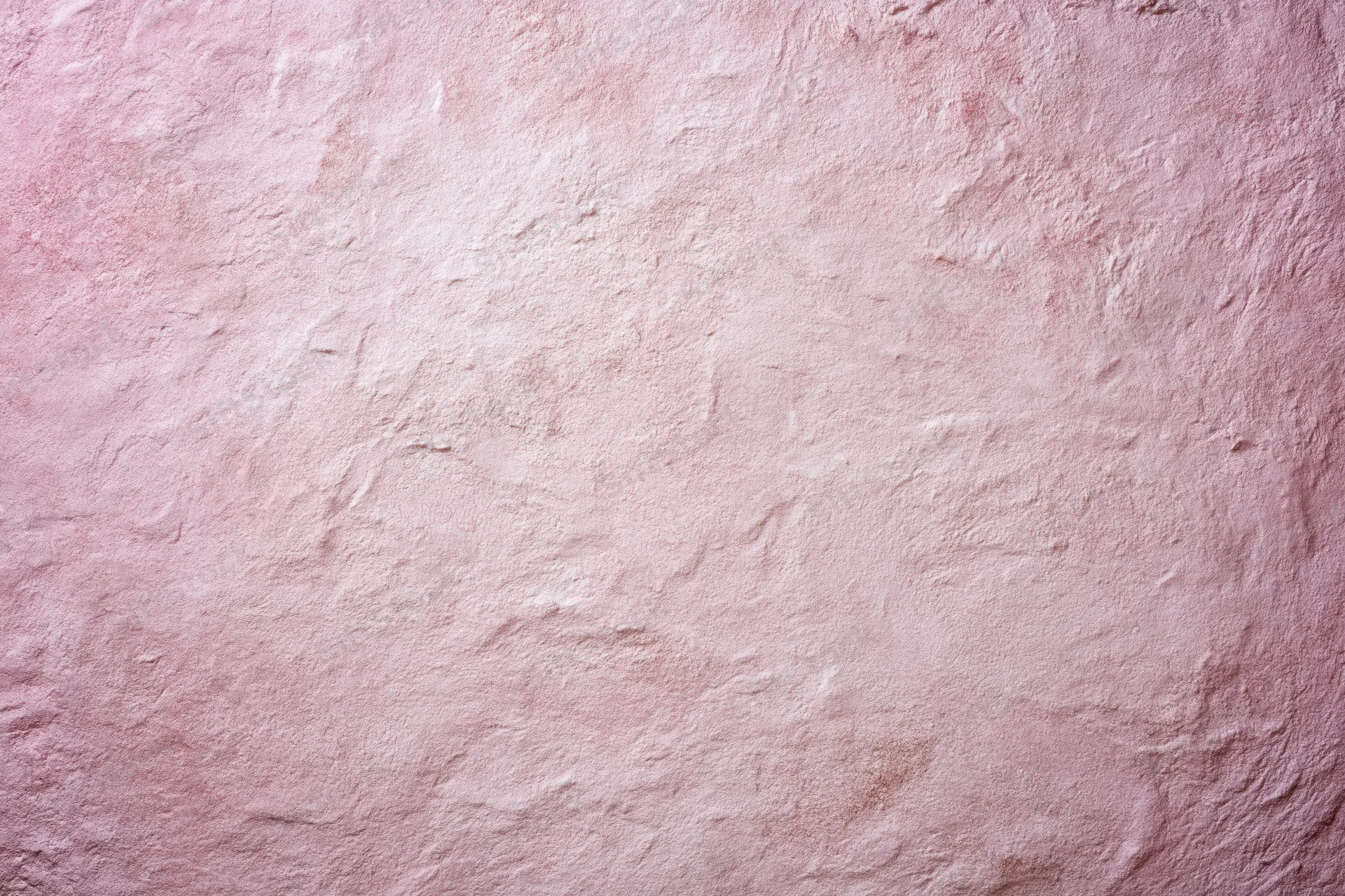 Matte pink textured surface filling the frame as a background