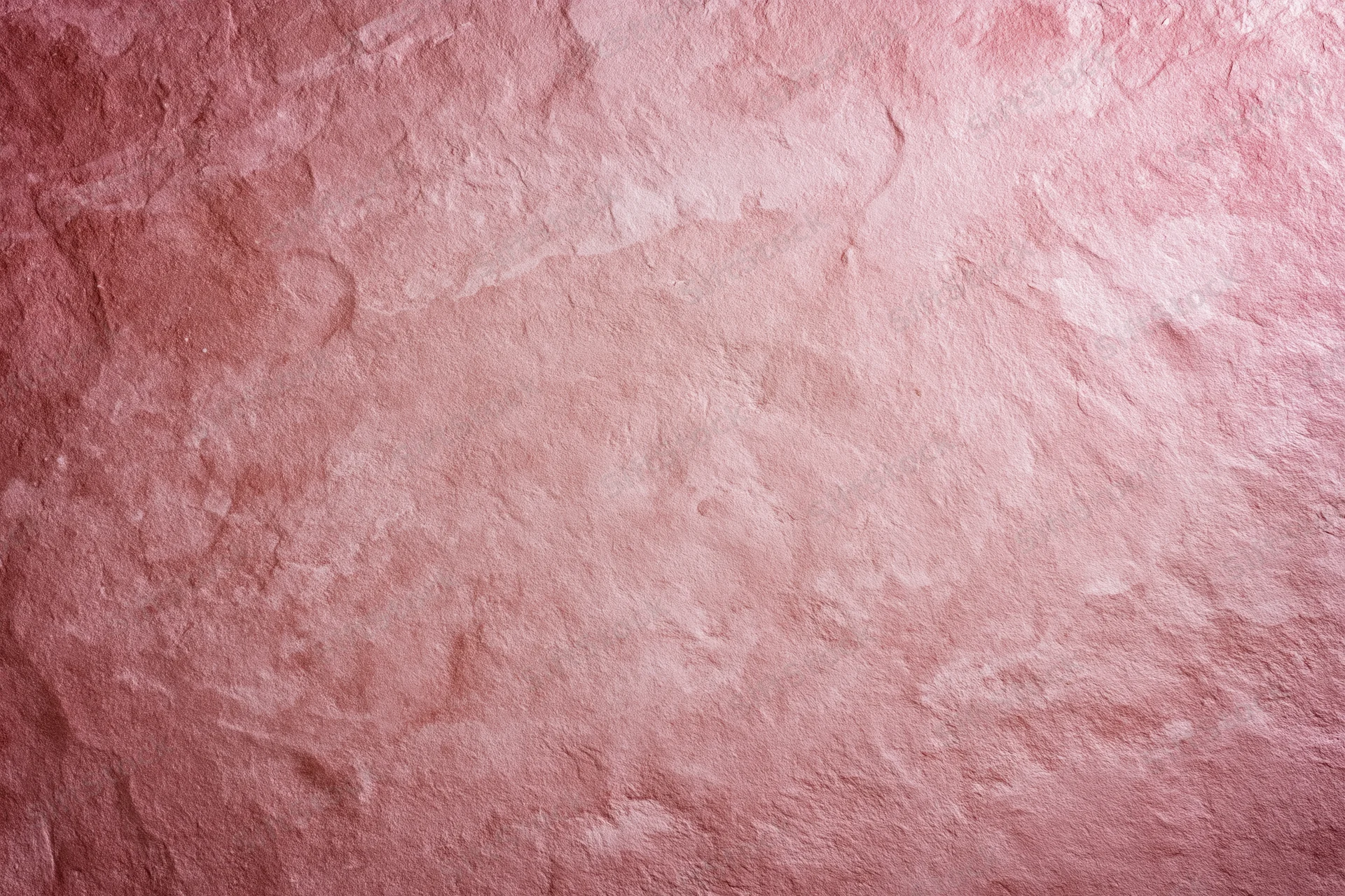 Matte pink textured surface filling the frame as a background