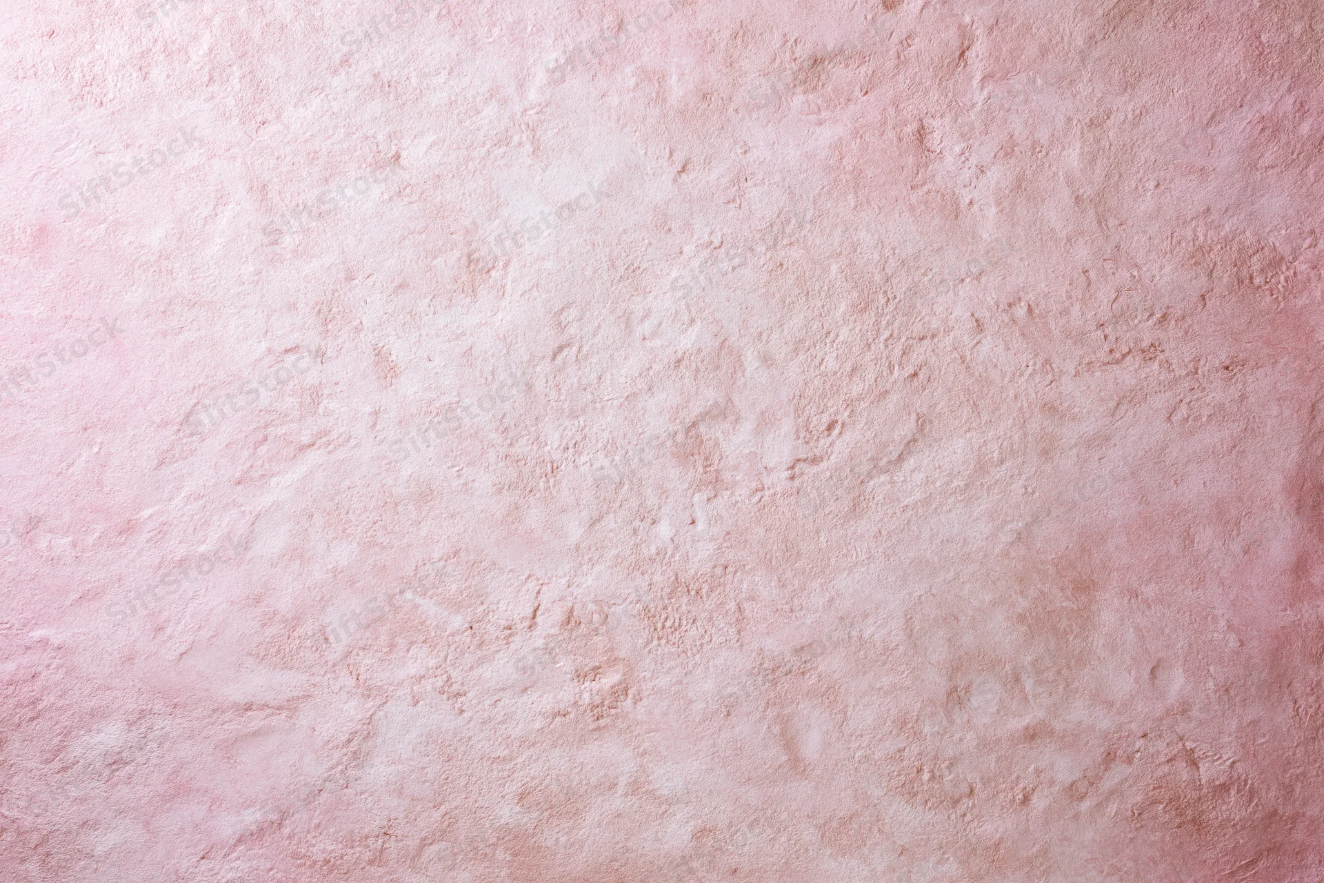 Matte pink textured surface filling the frame as a background