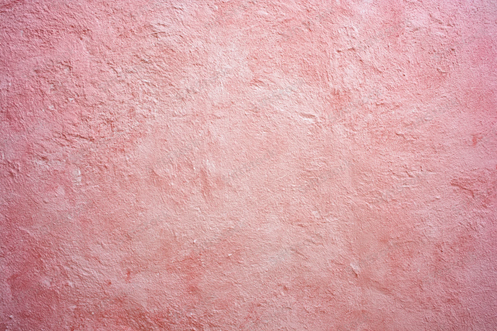 Matte pink textured surface filling the frame as a background