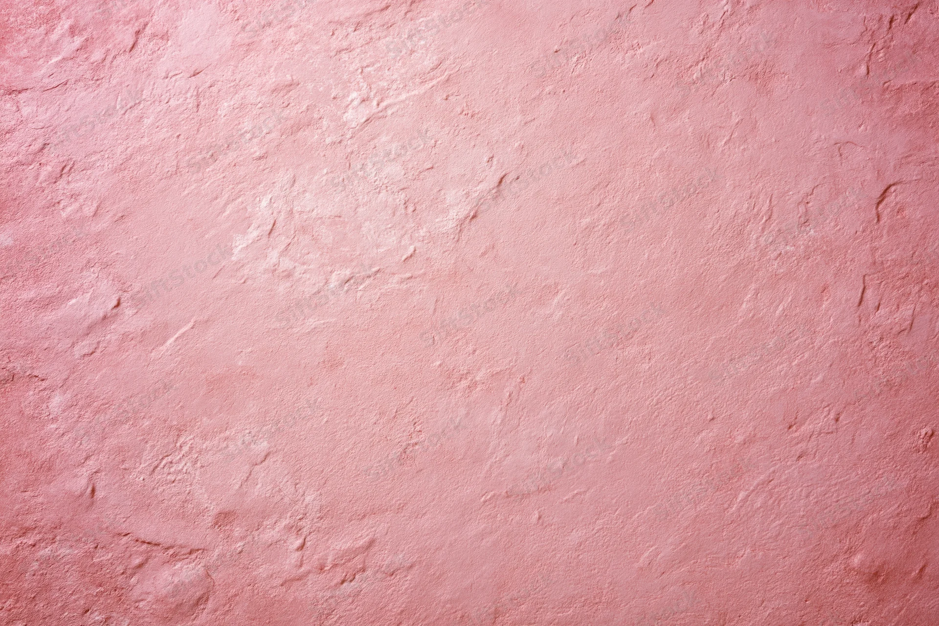 Matte pink textured surface filling the frame as a background