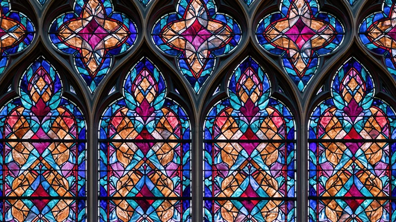 Gothic cathedral stained glass windows filling the frame with colorful geometric patterns and arched designs