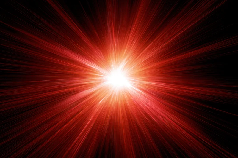 Intense radial light burst exploding from a central bright point against a dark background