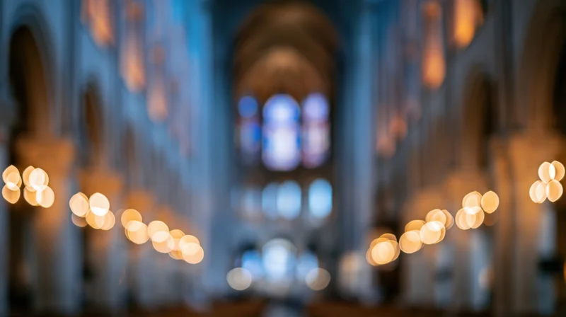 Defocused interior of a grand cathedral nave with warm bokeh lights and stone arches