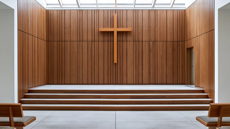 Modern protestant church sanctuary with wooden cross on altar platform and empty pews under skylight ceiling